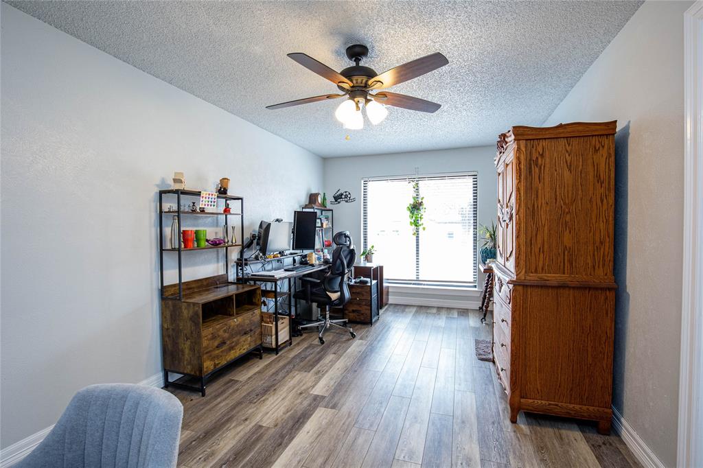 735 Willow Grove Road Woodway, TX 76712 - Photo 23 of 39 a view of a workspace with furniture and a window