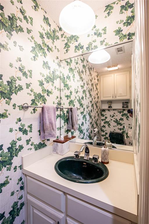 735 Willow Grove Road Woodway, TX 76712 - Photo 24 of 39 a bathroom with a sink and a mirror