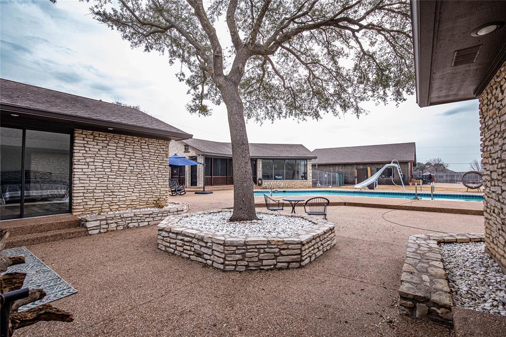 735 Willow Grove Road Woodway, TX 76712 - Photo 25 of 39 a front view of a house with swimming pool