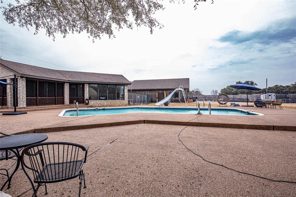 735 Willow Grove Road Woodway, TX 76712 - Photo 27 of 39 a swimming pool with outdoor seating and yard