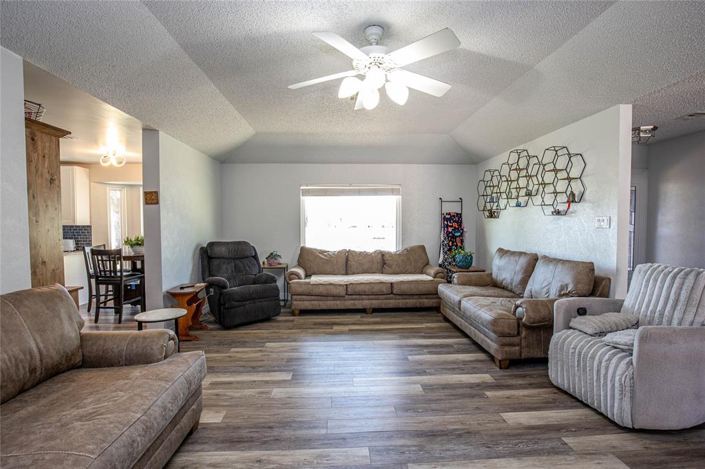735 Willow Grove Road Woodway, TX 76712 - Photo 3 of 39 a living room with furniture and a large window