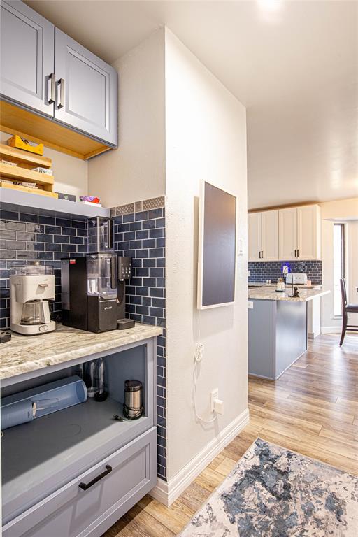 735 Willow Grove Road Woodway, TX 76712 - Photo 9 of 39 a kitchen with stainless steel appliances kitchen island granite countertop a refrigerator and a stove
