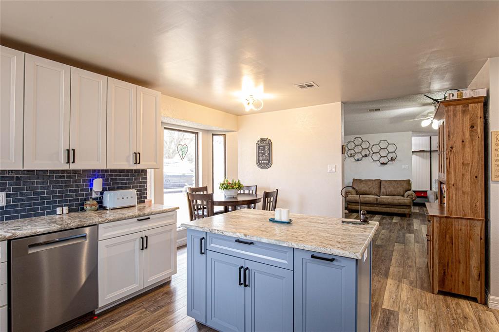 735 Willow Grove Road Woodway, TX 76712 - Photo 10 of 39 a kitchen with a sink stove and cabinets