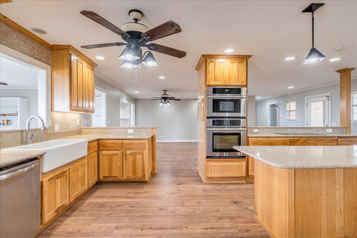595 Cardinal Road Rosanky, TX 78953 - Photo 11 of 39 a kitchen with stainless steel appliances granite countertop a stove and cabinets