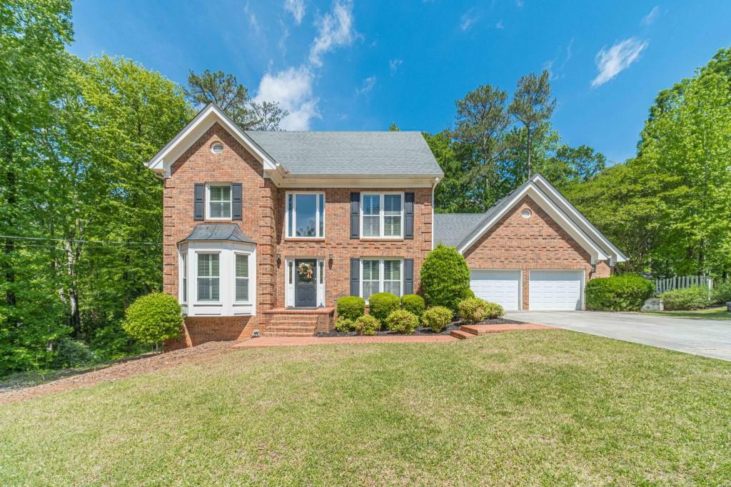 816 McDaniel Street Monroe, GA 30655 - Photo 1 of 52 a front view of a house with garden
