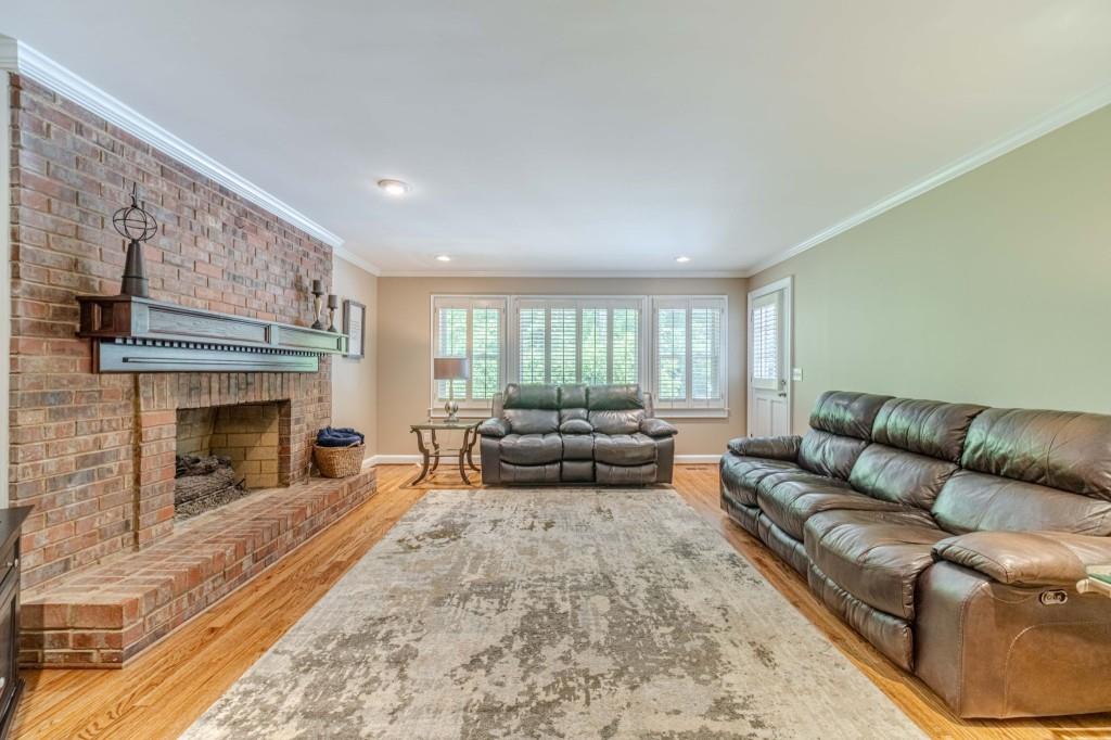 816 McDaniel Street Monroe, GA 30655 - Photo 13 of 52 a living room with furniture and a fireplace