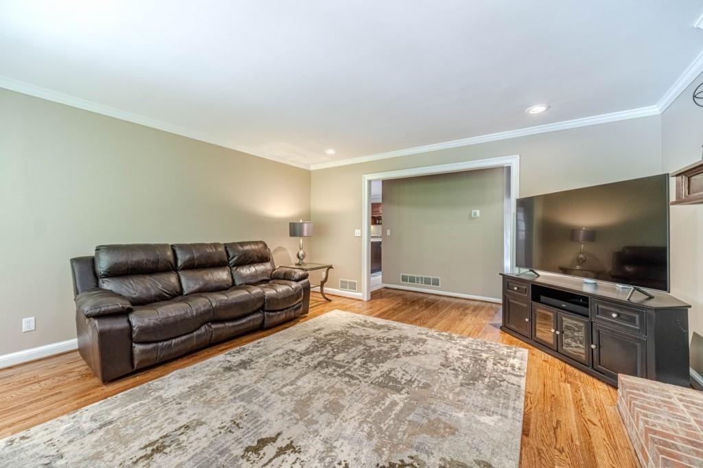816 McDaniel Street Monroe, GA 30655 - Photo 14 of 52 a living room with furniture and a flat screen tv