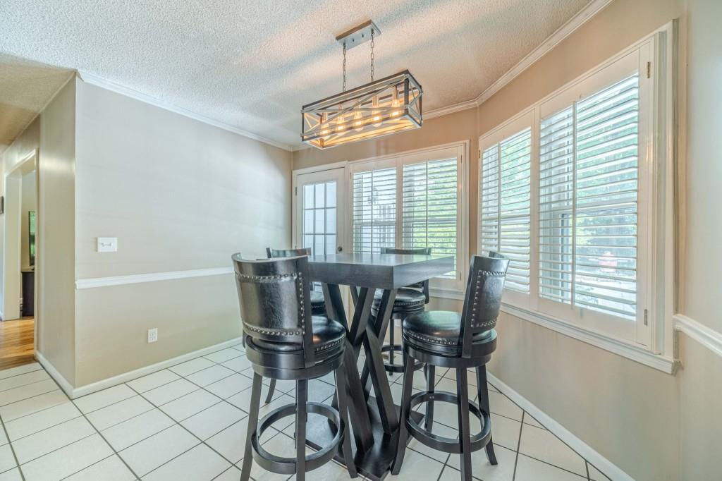 816 McDaniel Street Monroe, GA 30655 - Photo 22 of 52 a view of a dining room with furniture and windows