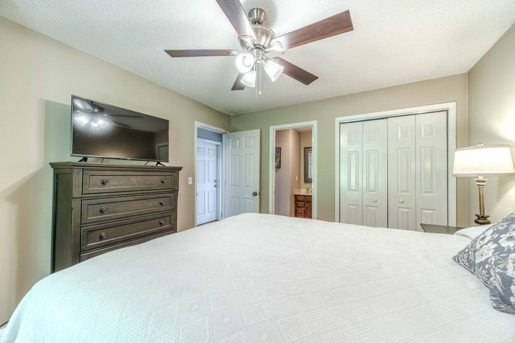 816 McDaniel Street Monroe, GA 30655 - Photo 24 of 52 a bedroom with a bed and a flat screen tv