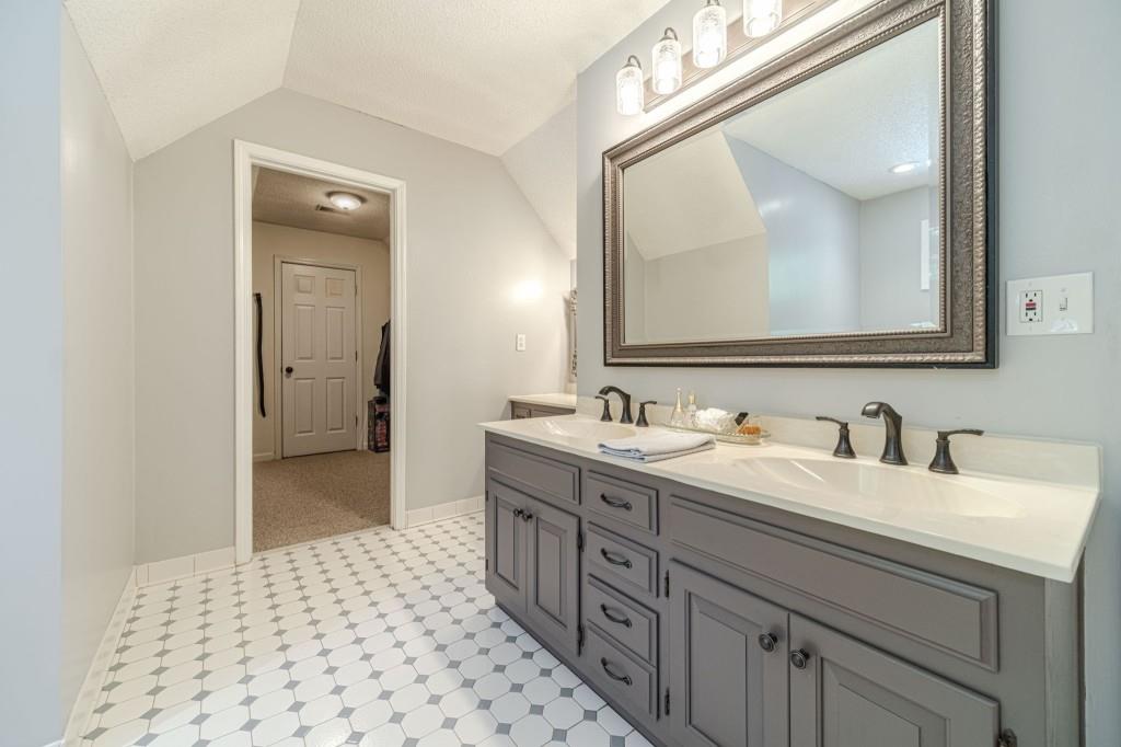 816 McDaniel Street Monroe, GA 30655 - Photo 29 of 52 a en suite bathroom with a double vanity sink and mirror