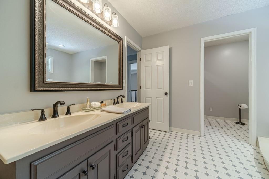 816 McDaniel Street Monroe, GA 30655 - Photo 30 of 52 a bathroom with a double vanity sink mirror and toilet