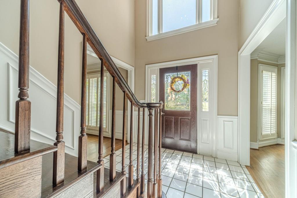 816 McDaniel Street Monroe, GA 30655 - Photo 6 of 52 a view of an entryway with wooden floor and door