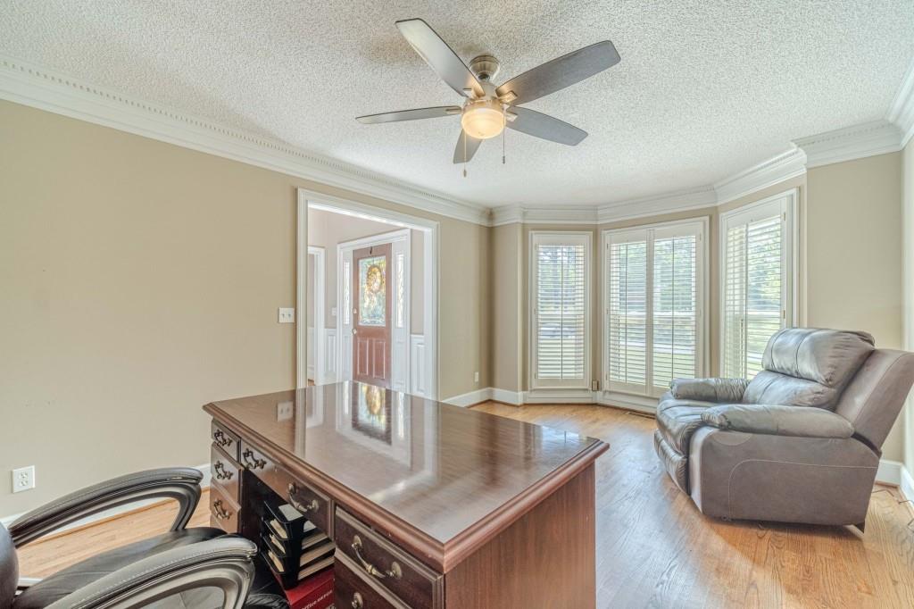 816 McDaniel Street Monroe, GA 30655 - Photo 7 of 52 a living room with furniture and a window
