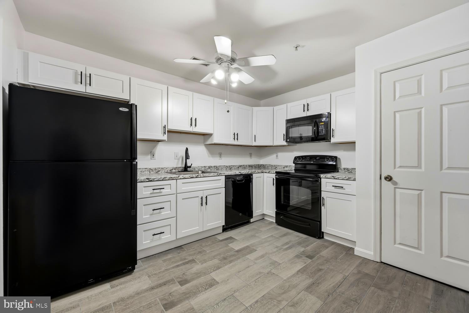 2627 Compass Drive Annapolis, MD 21401 - Photo 13 of 37 a kitchen with a refrigerator stove and microwave