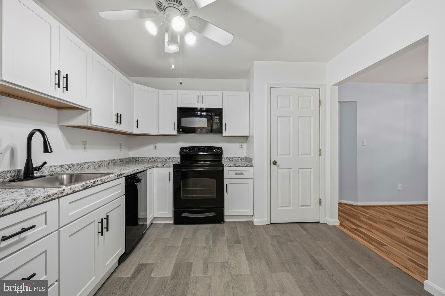 2627 Compass Drive Annapolis, MD 21401 - Photo 14 of 37 a kitchen with stainless steel appliances granite countertop a stove a sink and a refrigerator