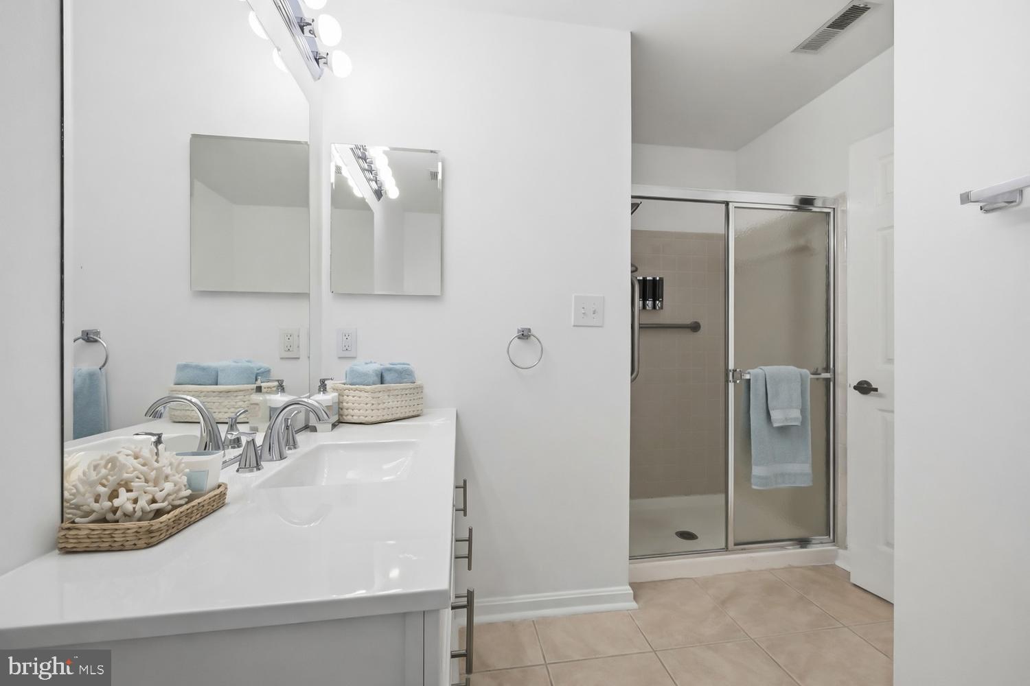 2627 Compass Drive Annapolis, MD 21401 - Photo 24 of 37 a bathroom with a sink and a mirror