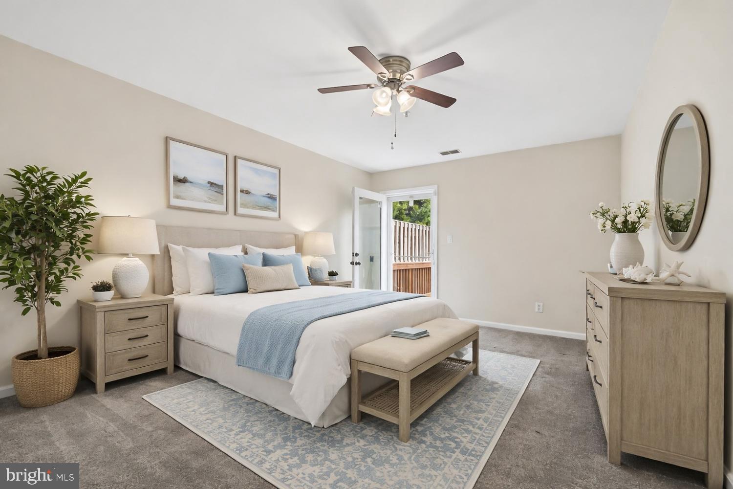 2627 Compass Drive Annapolis, MD 21401 - Photo 26 of 37 a bedroom with a large bed and a chandelier