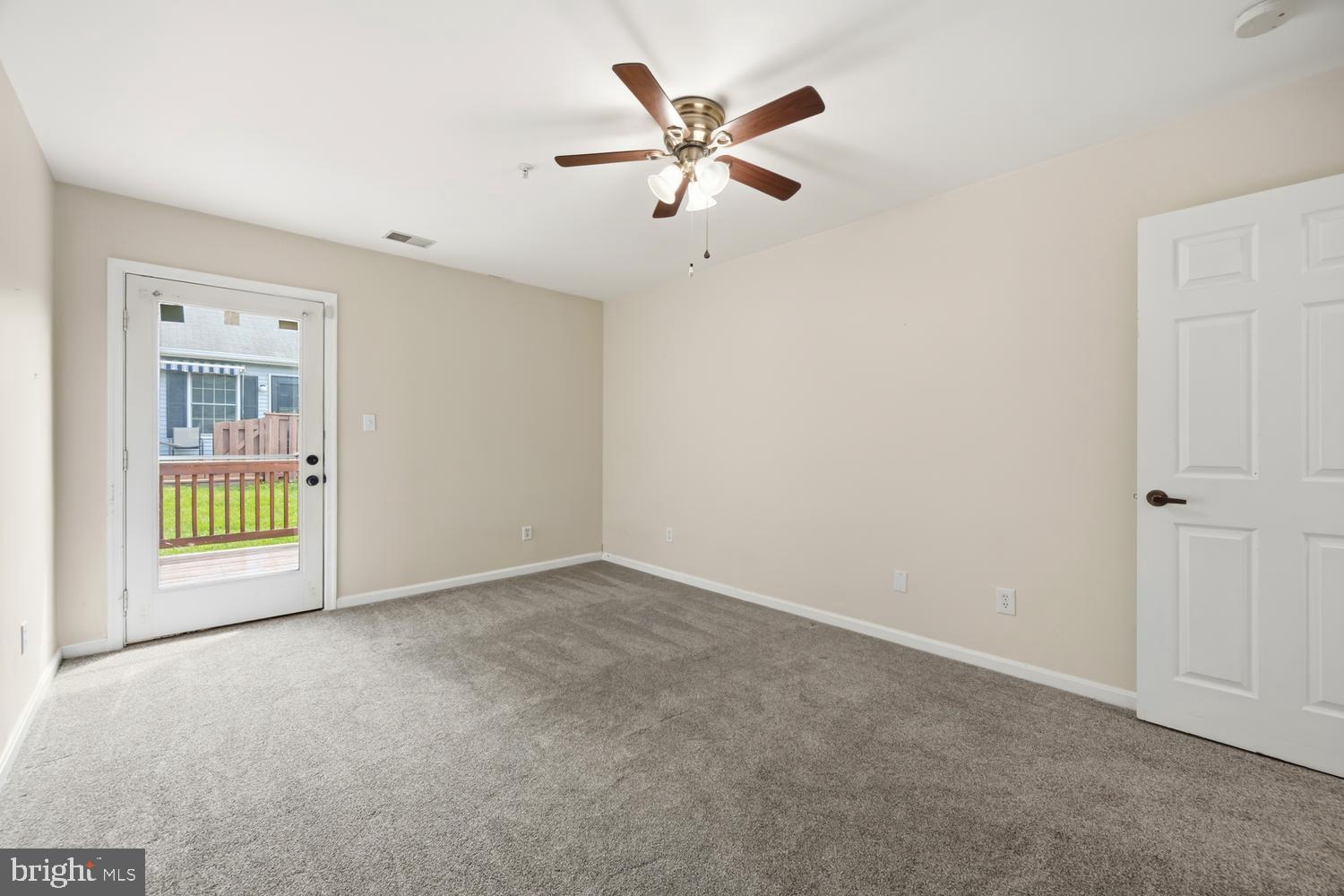 2627 Compass Drive Annapolis, MD 21401 - Photo 28 of 37 an empty room with windows and fan