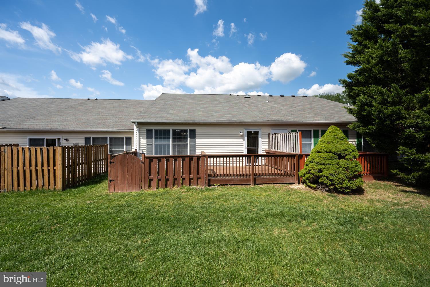 2627 Compass Drive Annapolis, MD 21401 - Photo 33 of 37 a view of a house with a yard and a garden