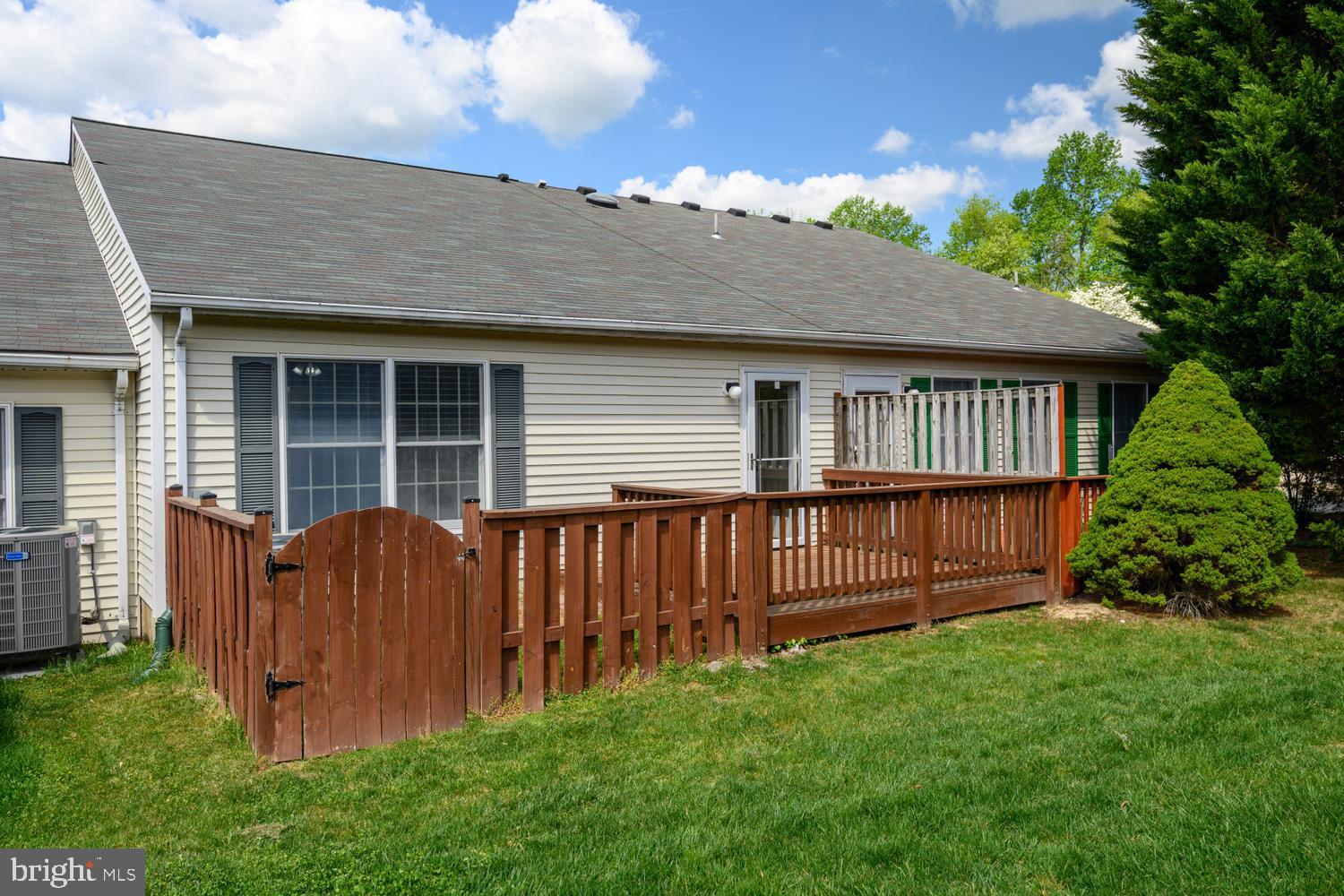 2627 Compass Drive Annapolis, MD 21401 - Photo 34 of 37 a view of backyard with potted plants and wooden fence