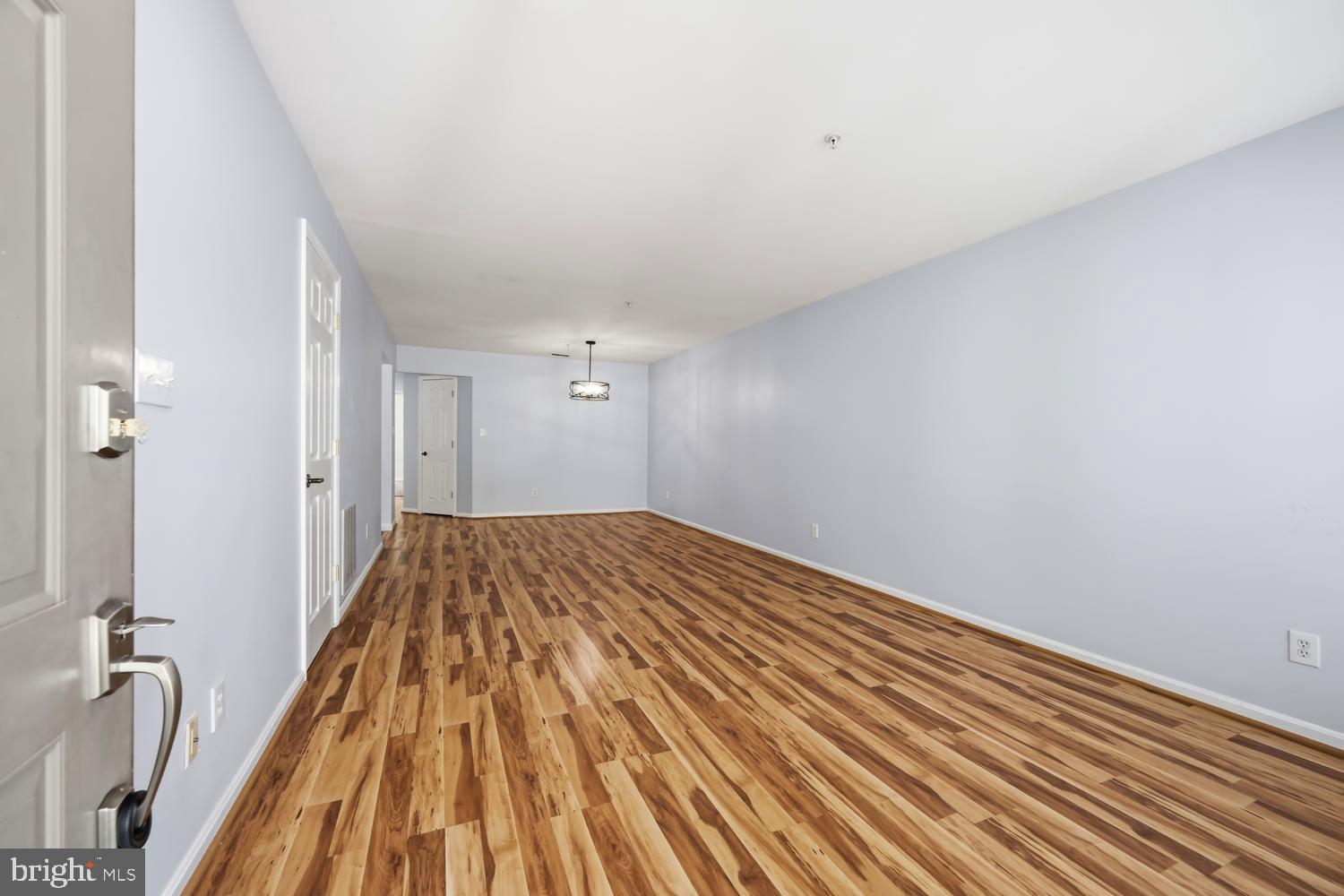 2627 Compass Drive Annapolis, MD 21401 - Photo 5 of 37 a view of a bedroom with a bed and wooden floor