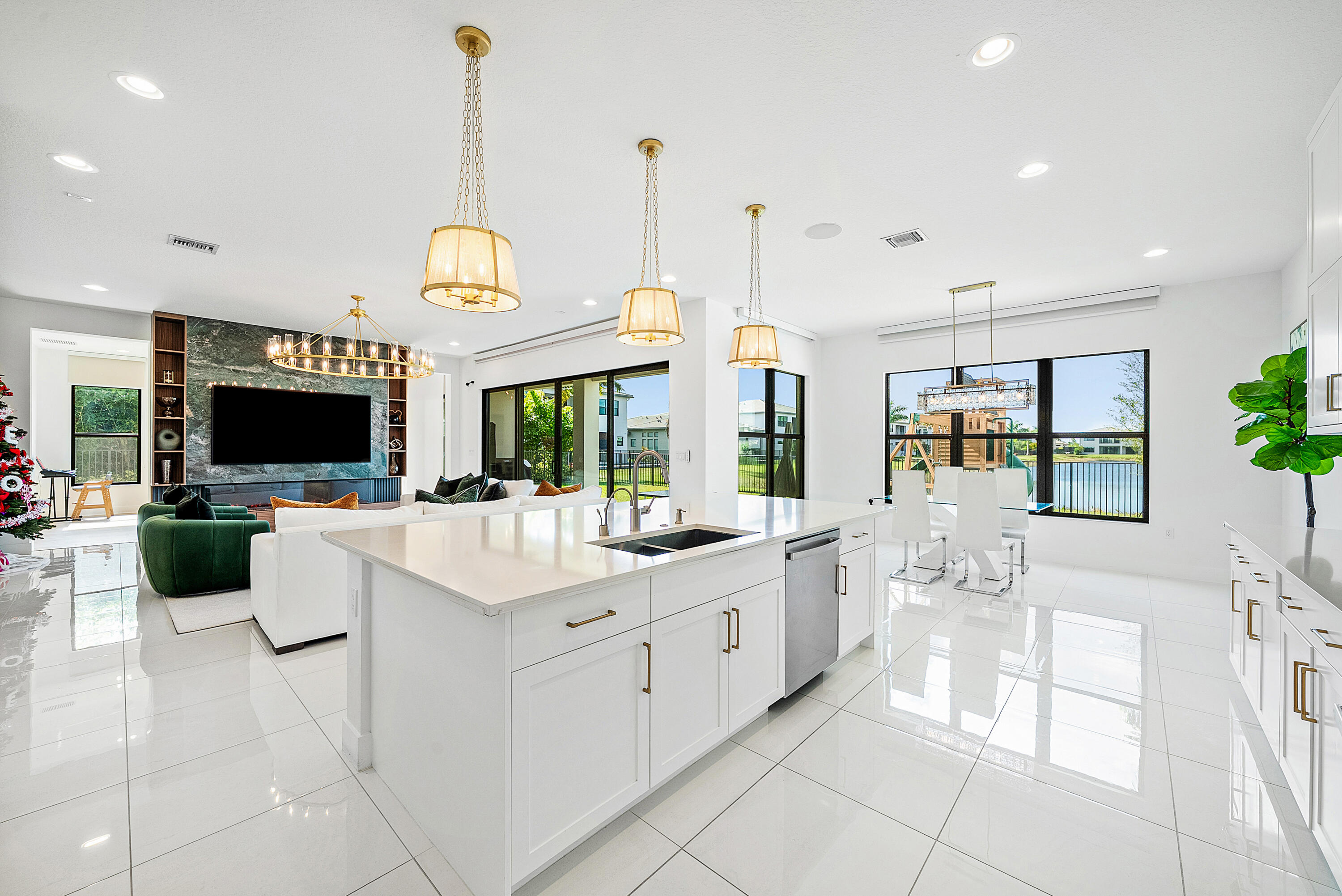20145 Castle Stuart Avenue Boca Raton, FL 33434 - Photo 11 of 95 a large white kitchen with a large window and stainless steel appliances