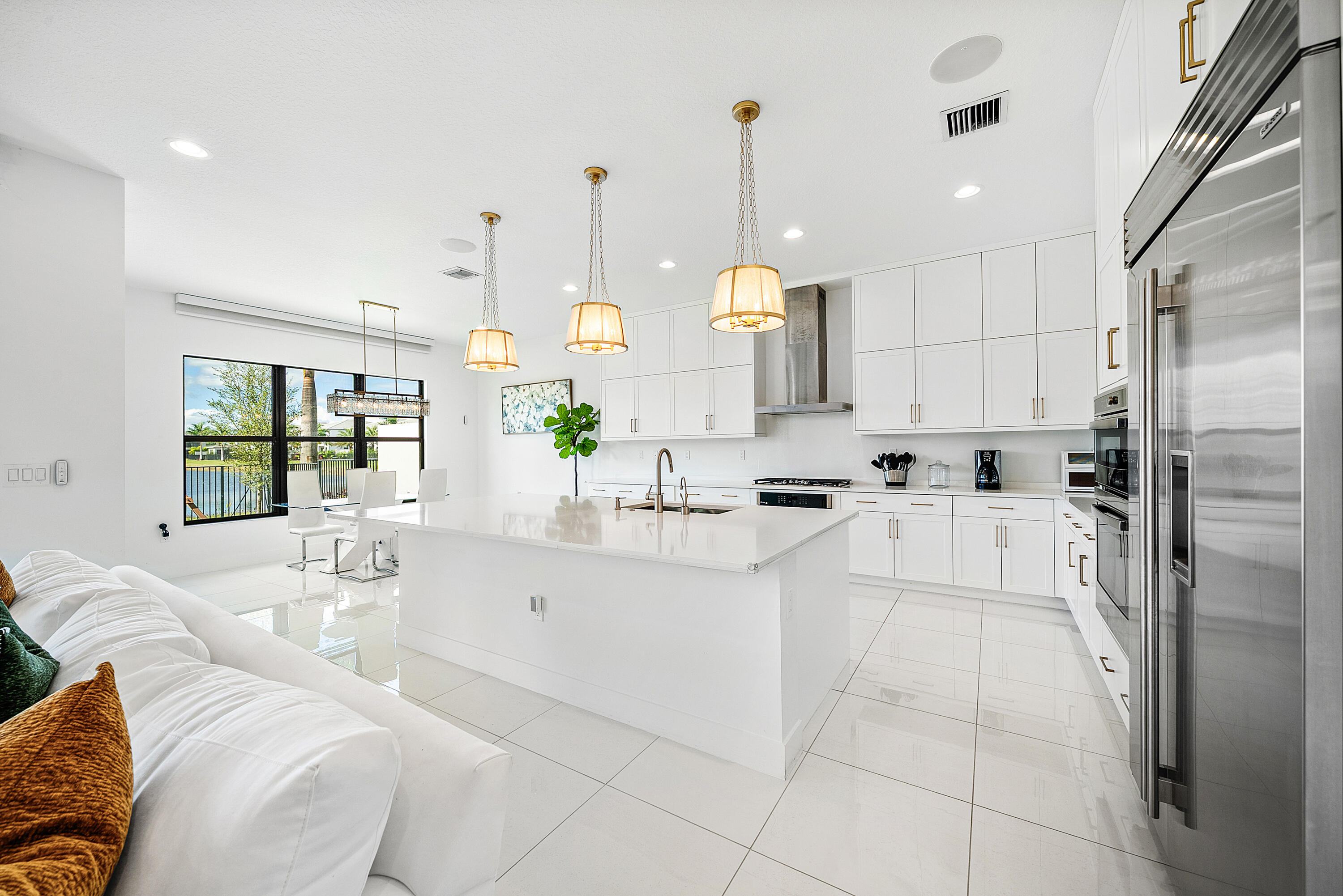 20145 Castle Stuart Avenue Boca Raton, FL 33434 - Photo 12 of 95 a large white kitchen with a large window