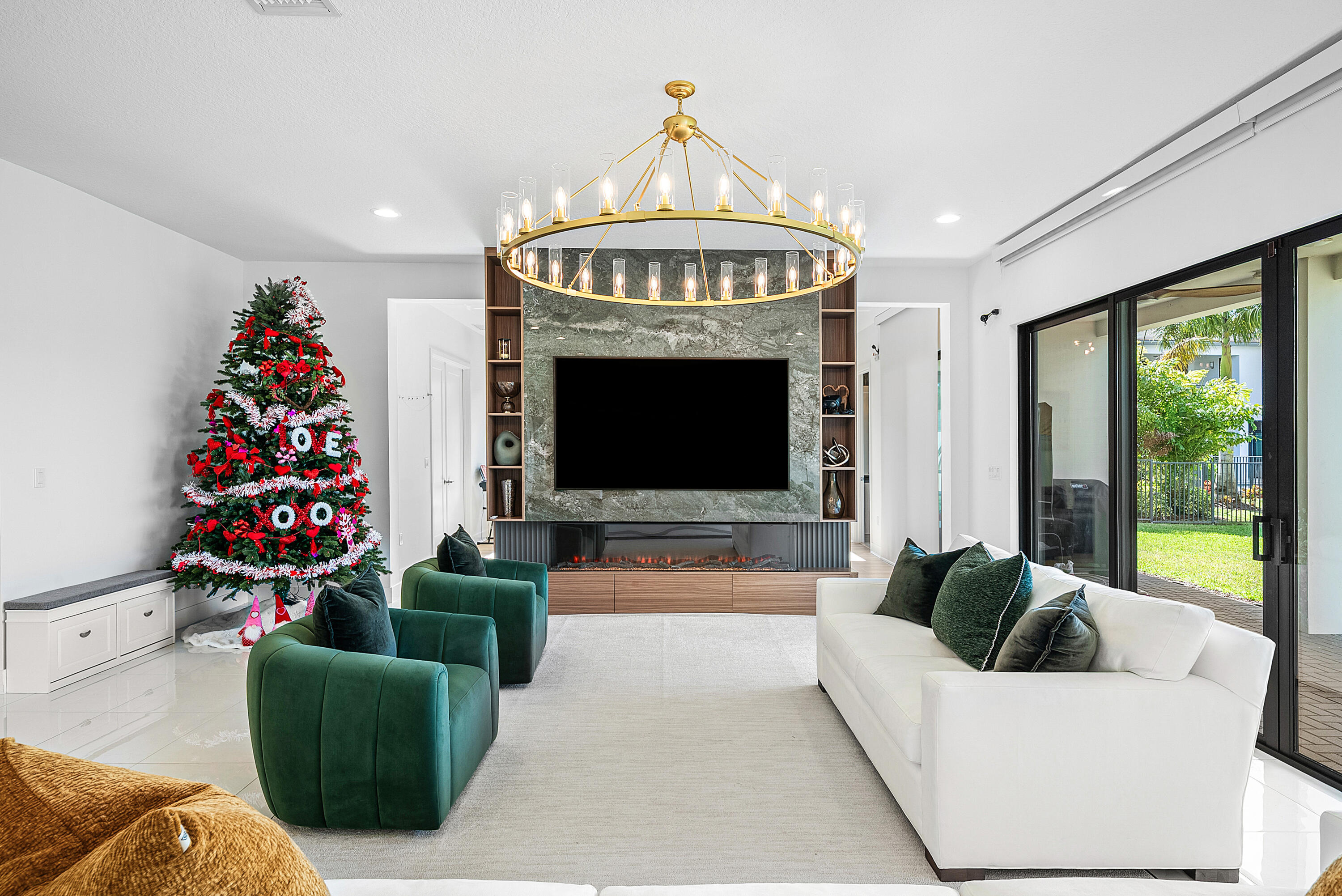 20145 Castle Stuart Avenue Boca Raton, FL 33434 - Photo 15 of 95 a living room with furniture a fireplace and a chandelier