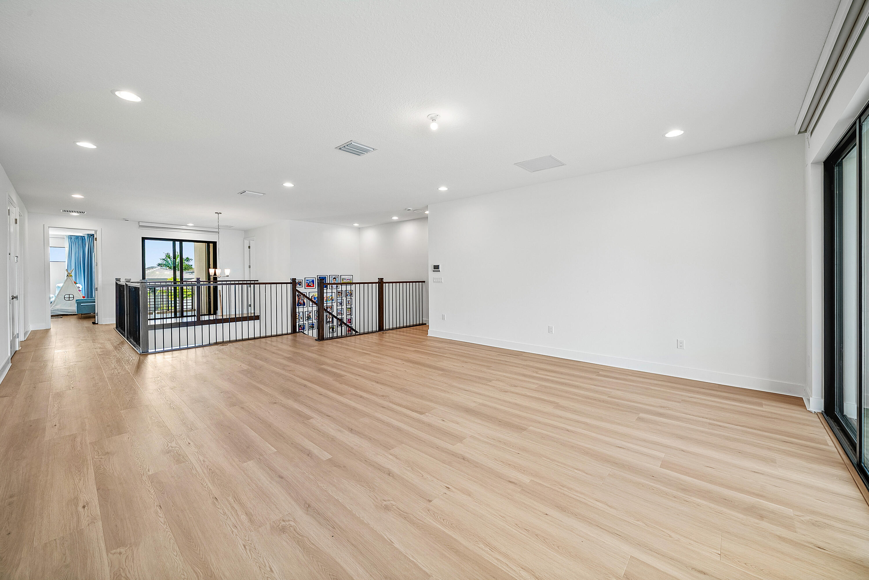 20145 Castle Stuart Avenue Boca Raton, FL 33434 - Photo 20 of 95 a view of empty room with wooden floor