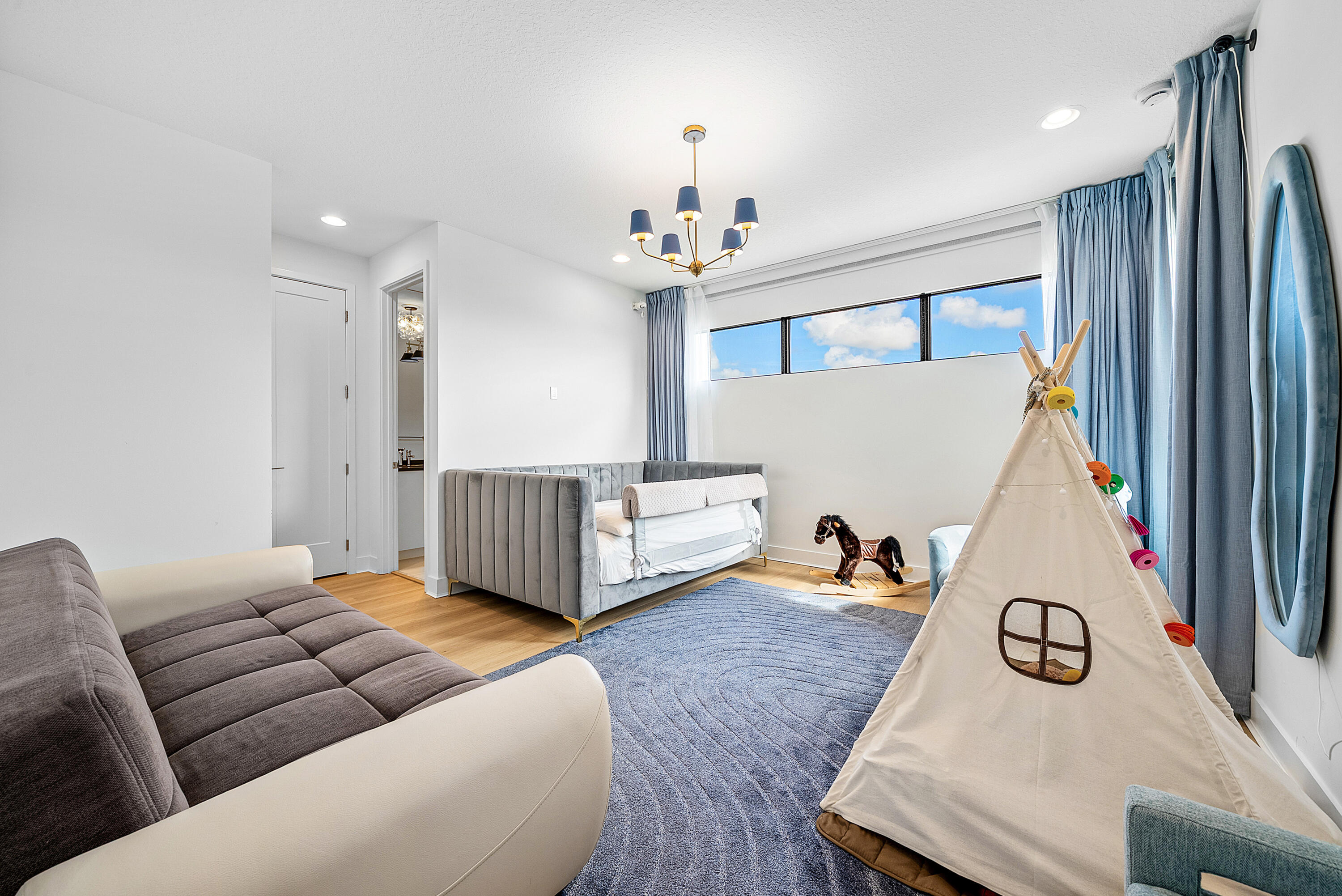 20145 Castle Stuart Avenue Boca Raton, FL 33434 - Photo 32 of 95 a living room with furniture and a flat screen tv