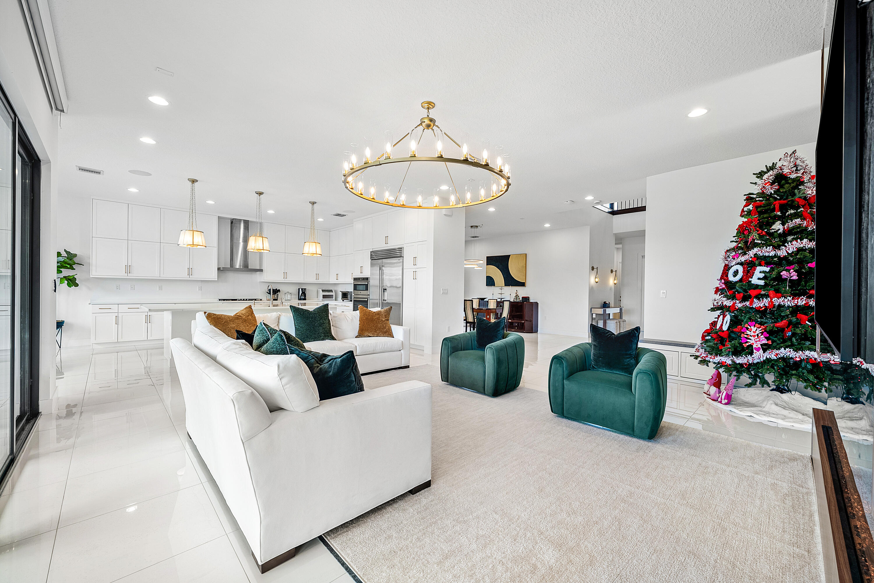 20145 Castle Stuart Avenue Boca Raton, FL 33434 - Photo 7 of 95 a living room with furniture and a chandelier