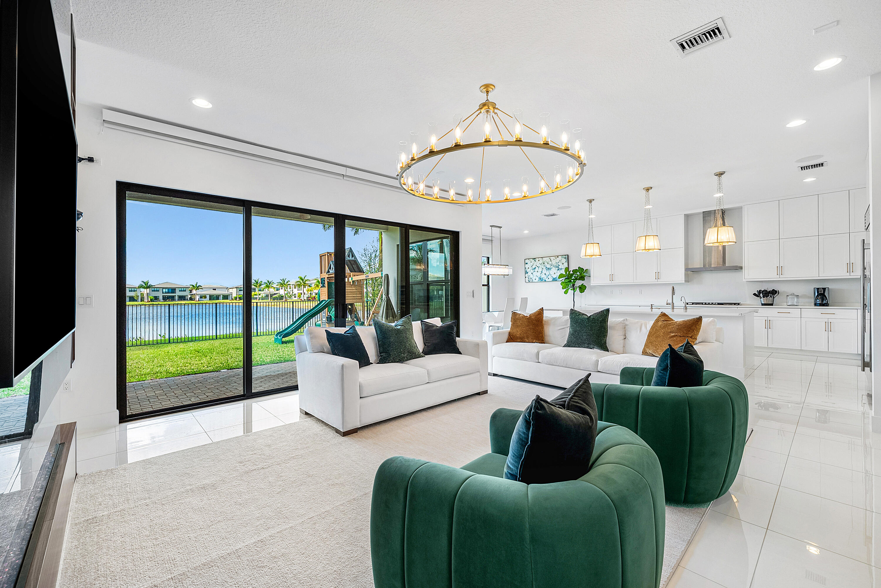 20145 Castle Stuart Avenue Boca Raton, FL 33434 - Photo 9 of 95 a living room with furniture fireplace and a large window