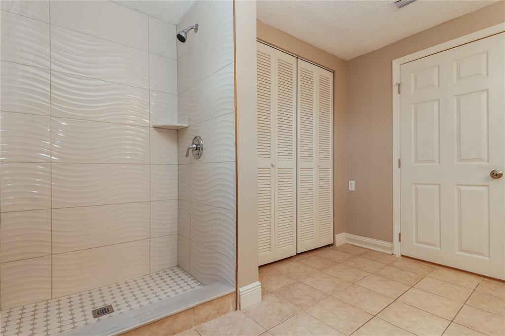 9226 Rainbow Lane Port Richey, FL 34668 - Photo 11 of 16 a bathroom with a shower