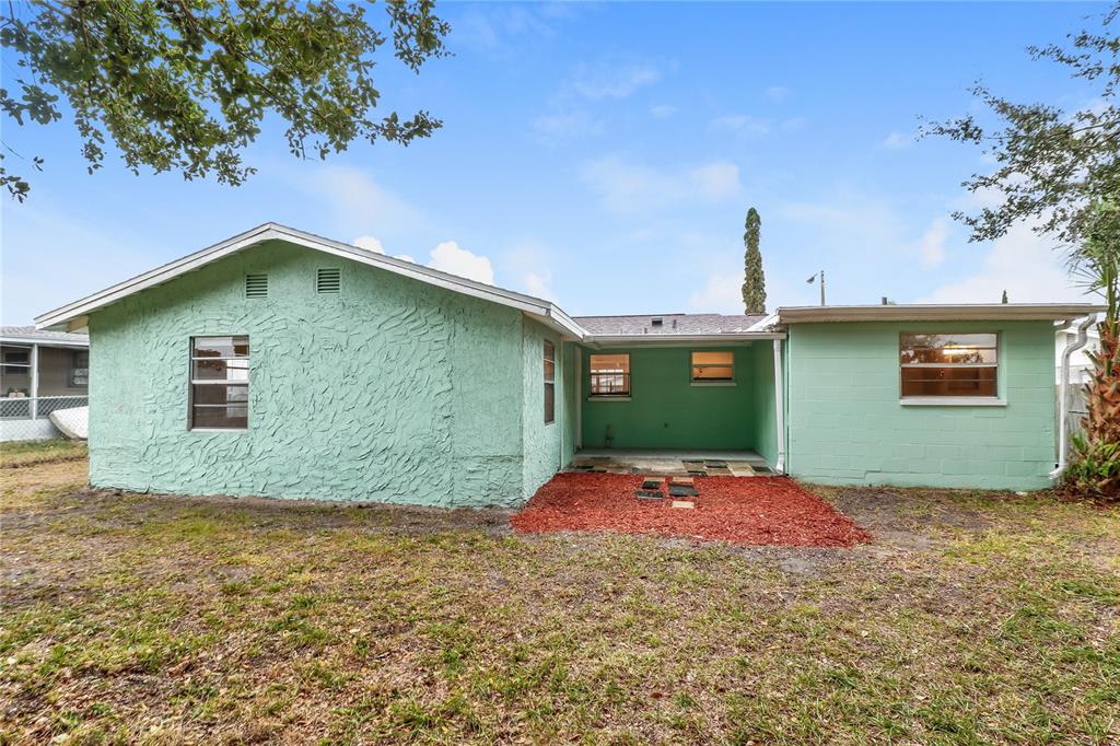 9226 Rainbow Lane Port Richey, FL 34668 - Photo 15 of 16 a backyard of a house