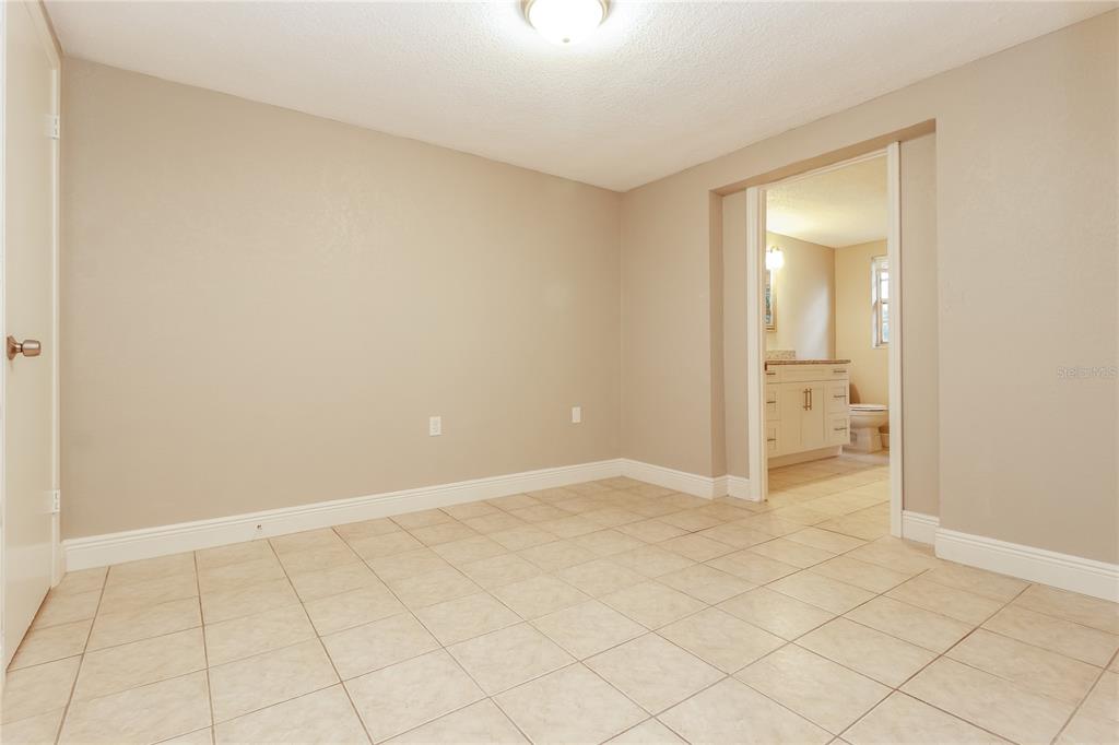 9226 Rainbow Lane Port Richey, FL 34668 - Photo 9 of 16 a view of an empty room and closet area