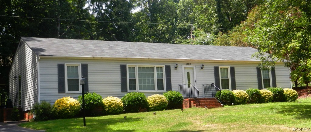 10940 Weybridge Road Chester, VA 23831 - Photo 1 of 16 a view of a house with a yard and plants