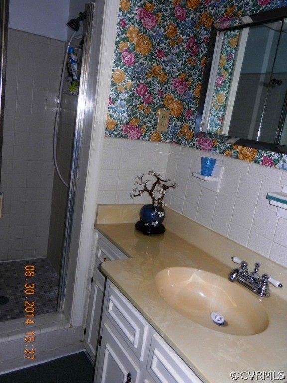 10940 Weybridge Road Chester, VA 23831 - Photo 14 of 16 a bathroom with a sink and a mirror