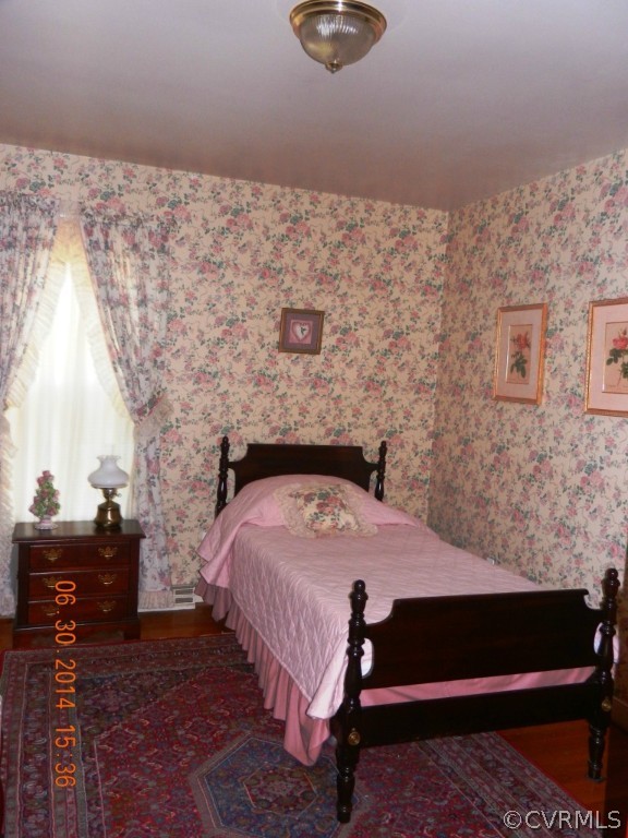 10940 Weybridge Road Chester, VA 23831 - Photo 16 of 16 a bedroom with a bed and a dresser