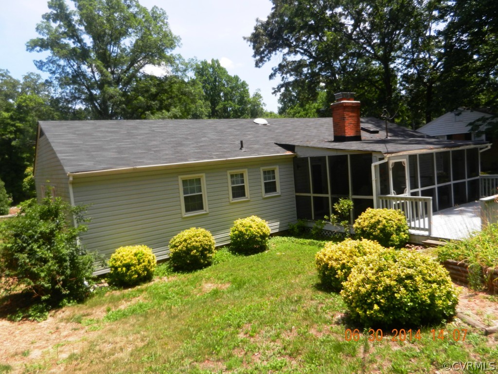 10940 Weybridge Road Chester, VA 23831 - Photo 3 of 16 a front view of a house with patio