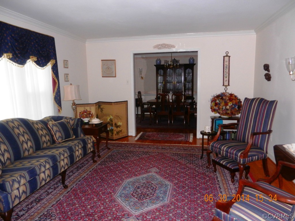 10940 Weybridge Road Chester, VA 23831 - Photo 10 of 16 a living room with furniture and a fireplace