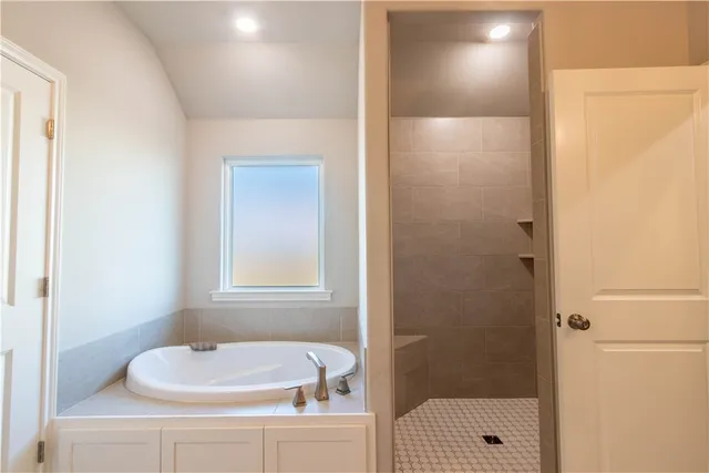 a kitchen with stainless steel appliances granite countertop a refrigerator and a stove