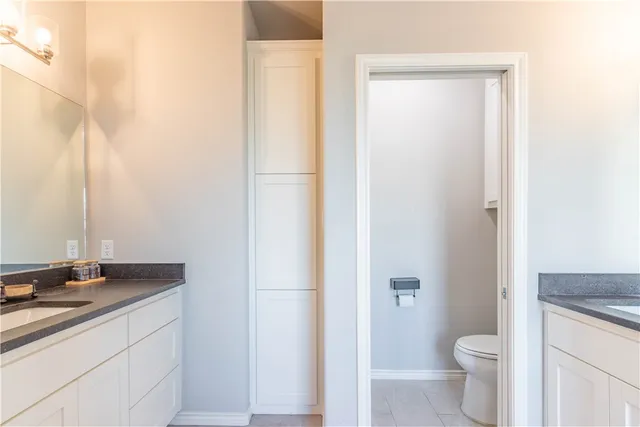 a bathroom with a tub shower and a sink