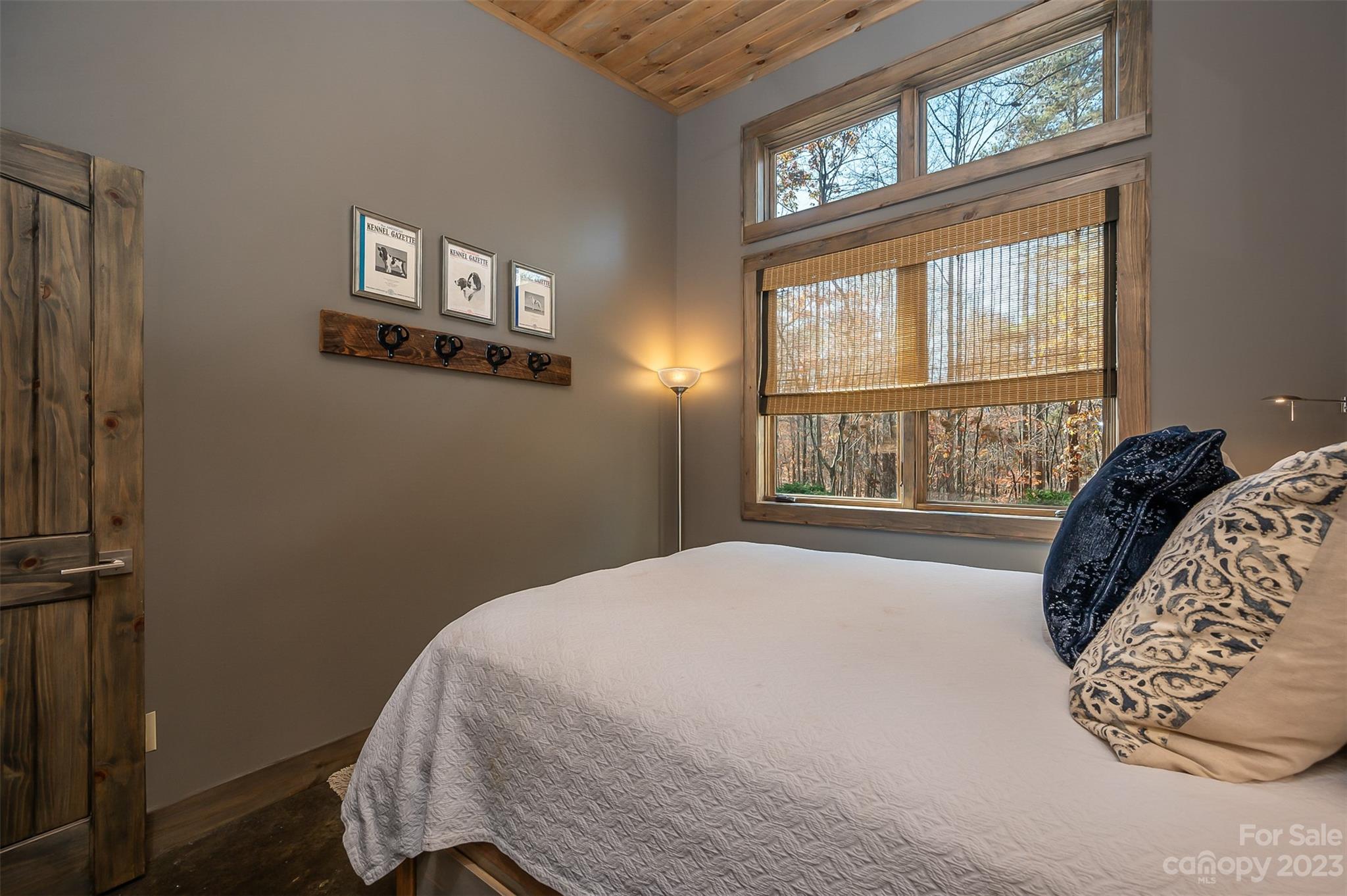 141 Herbert Page Road Tryon, NC 28782 - Photo 17 of 32 a bedroom with a bed and a window