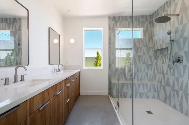 a utility room with cabinets washer and dryer