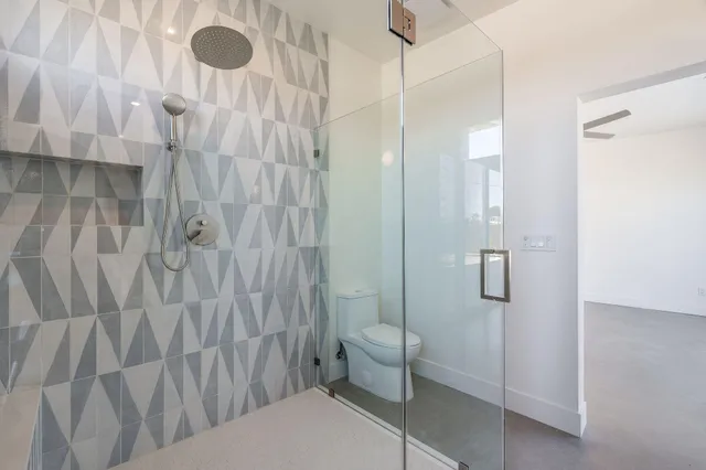 a utility room with cabinets washer and dryer