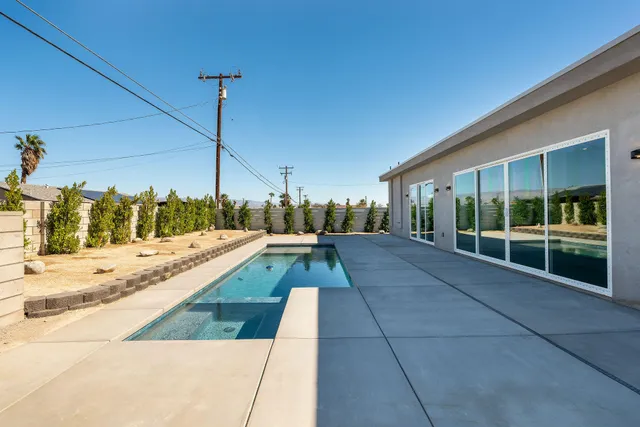a view of a house with wooden fence