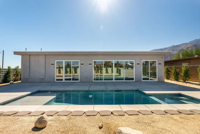 a view of a balcony with potted plants