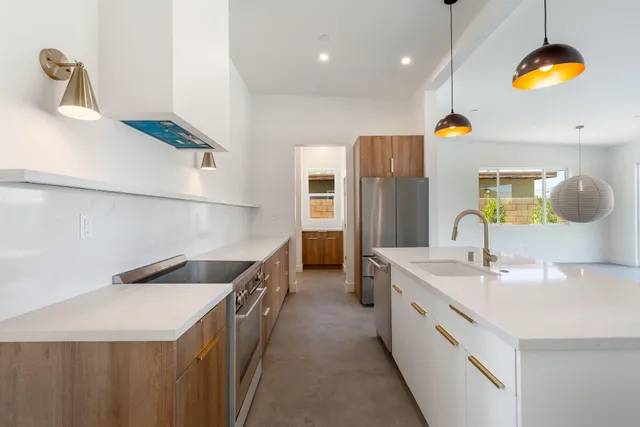 a kitchen with a sink and stove