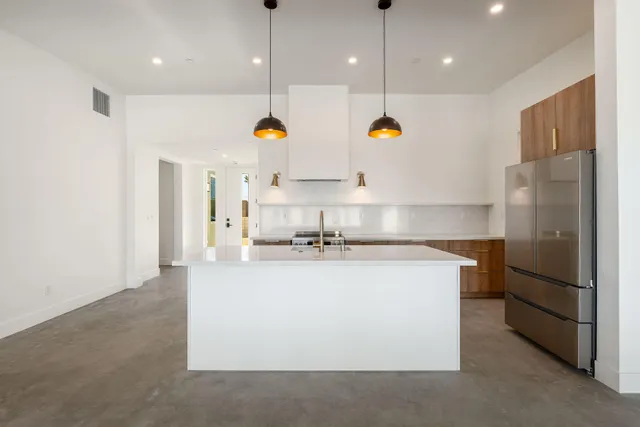 a kitchen with a sink and stove