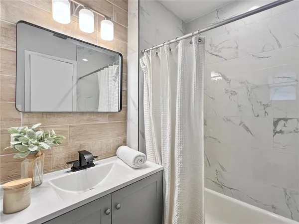 a bathroom with a sink and a mirror